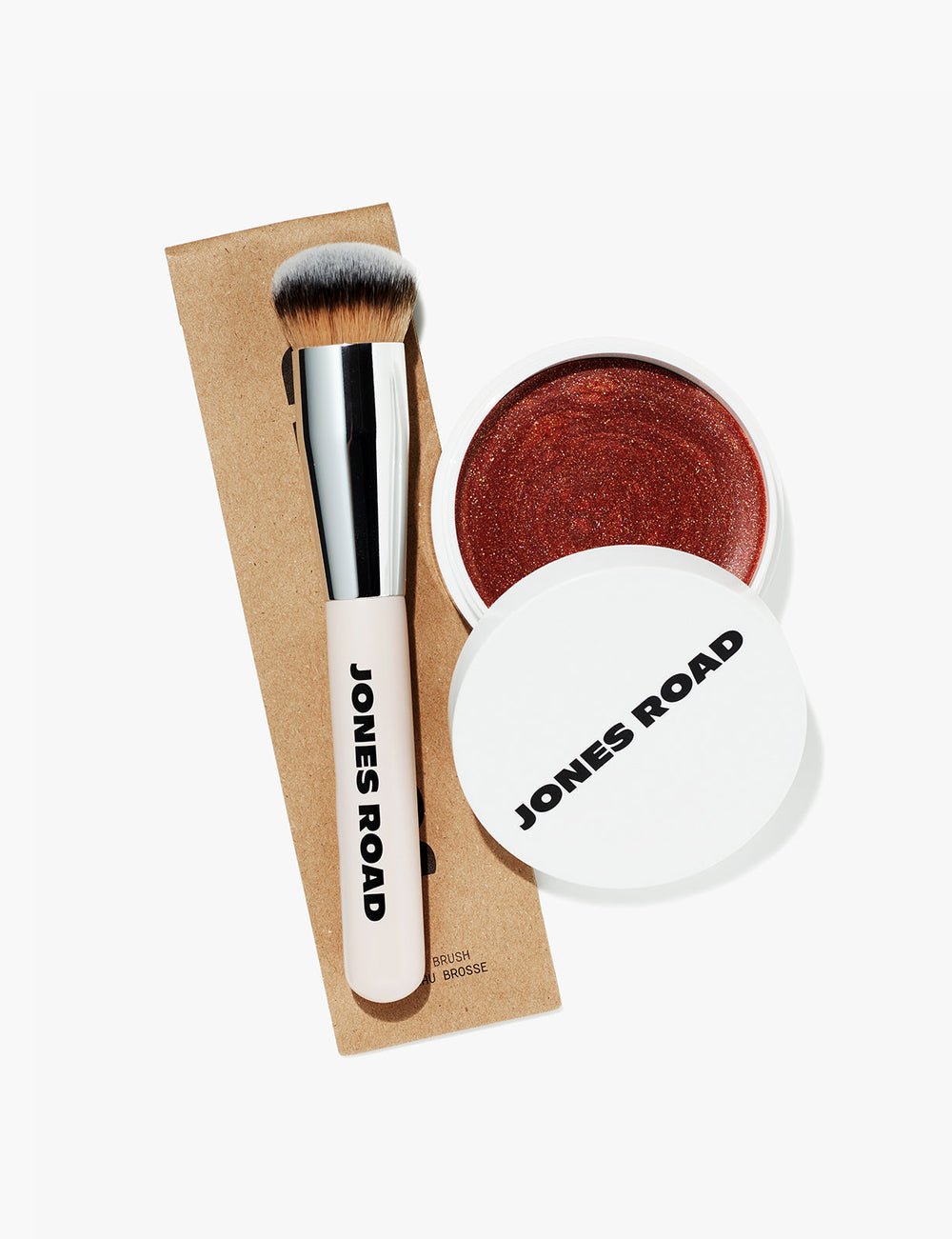 The Everything Brush pictured with Jones Road Beauty's Miracle Balm in Tawny