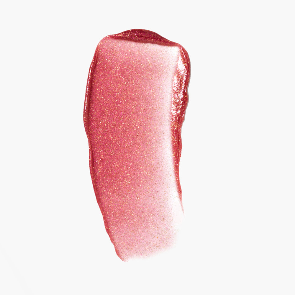 A swatch of Cool Gloss, a tinted lip gloss from Jones Road Beauty, in the shade Pink Gold Shimmer.