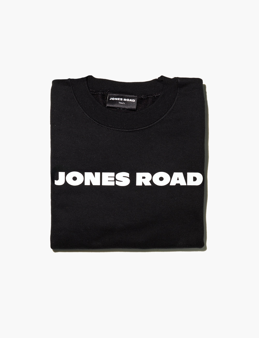 A folded-up Sweatshirt from Jones Road Beauty